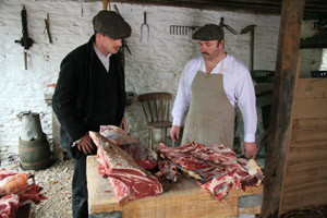 Cutting meat on Edwardian Farm, Morwellham Quay