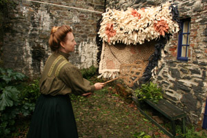 Edwardian Farm rug beating at Morwellham Quay